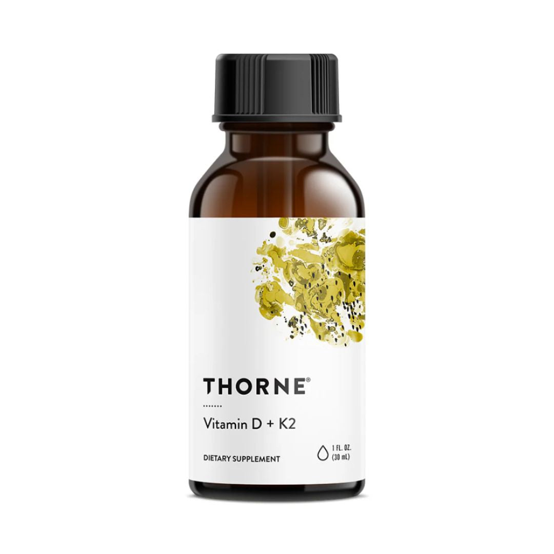 Thorne Vitamin D and K2 liquid drops bottle with dropper MCT oil base vitamin supplement label close up studio product image
