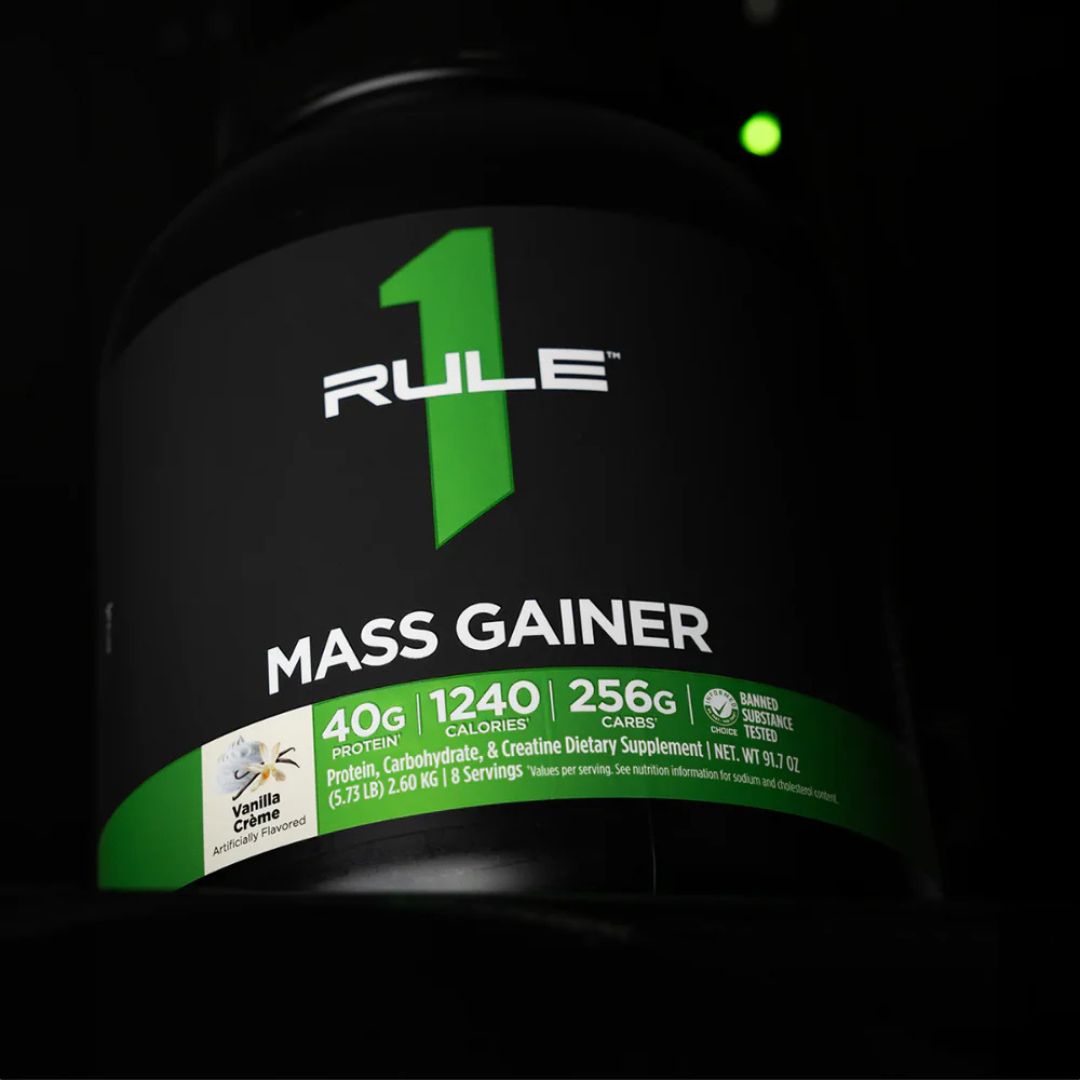 Rule 1 Mass Gainer protein powder tub – premium high-calorie mass gainer supplement for muscle growth, available at Nutrition Capital Australia.
