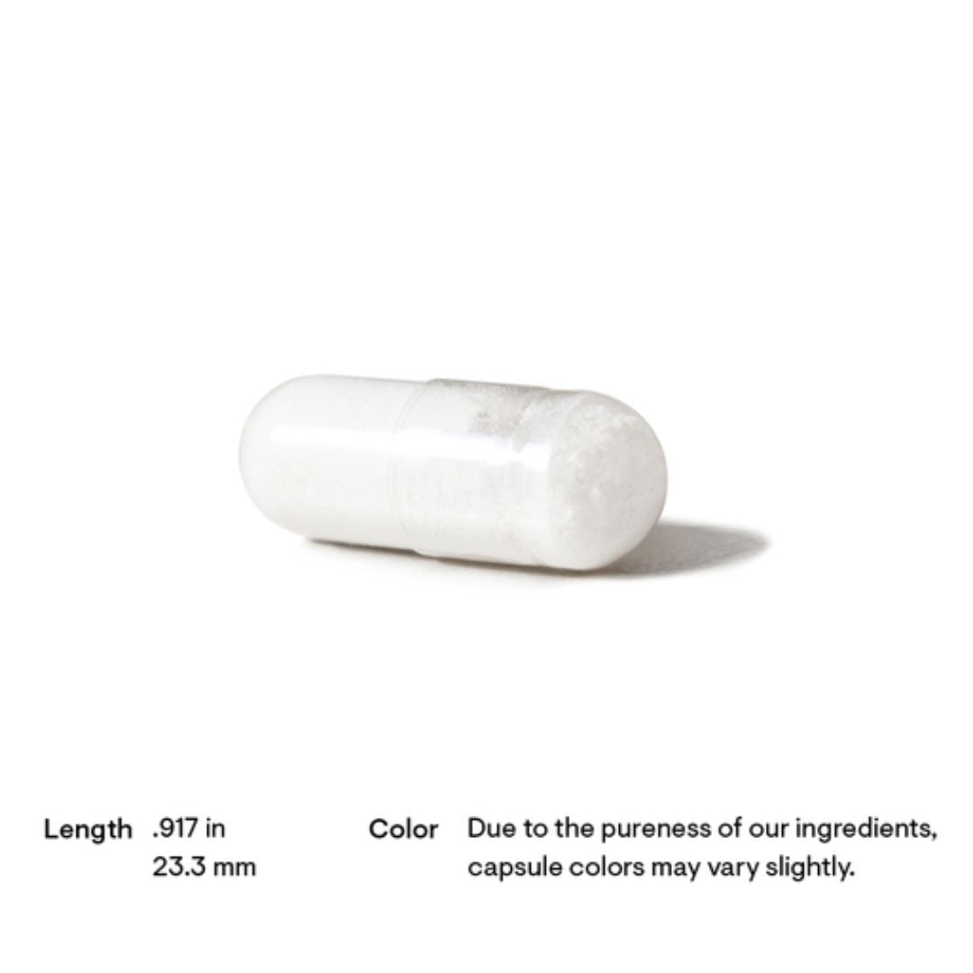 White capsule on a white background with text about dimensions and color variation.